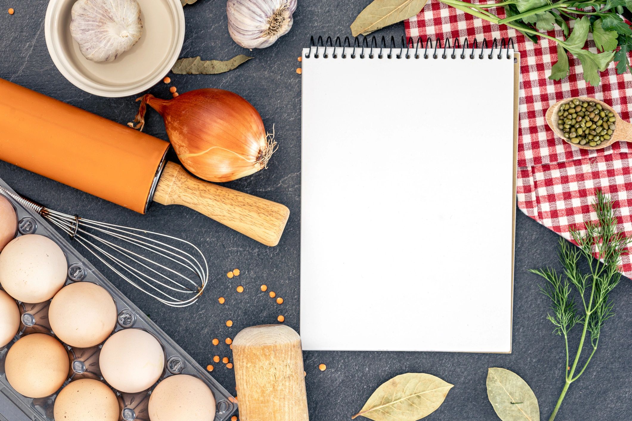 Cooking ingredients with blank notebook. Open recipe book.